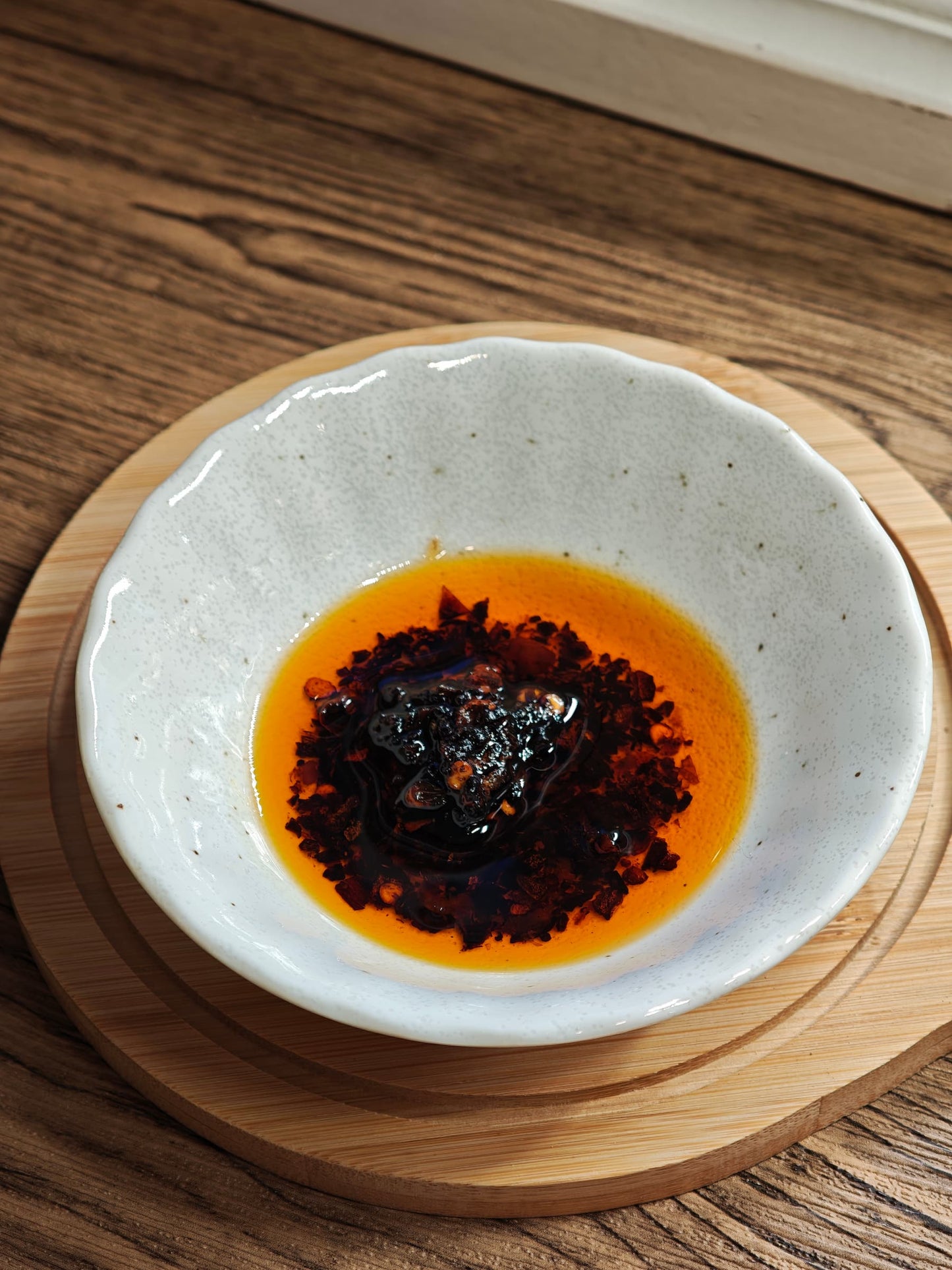 Jiang! x Sim Sim Foods - Crunchy Chilli Oil  in small dish close up