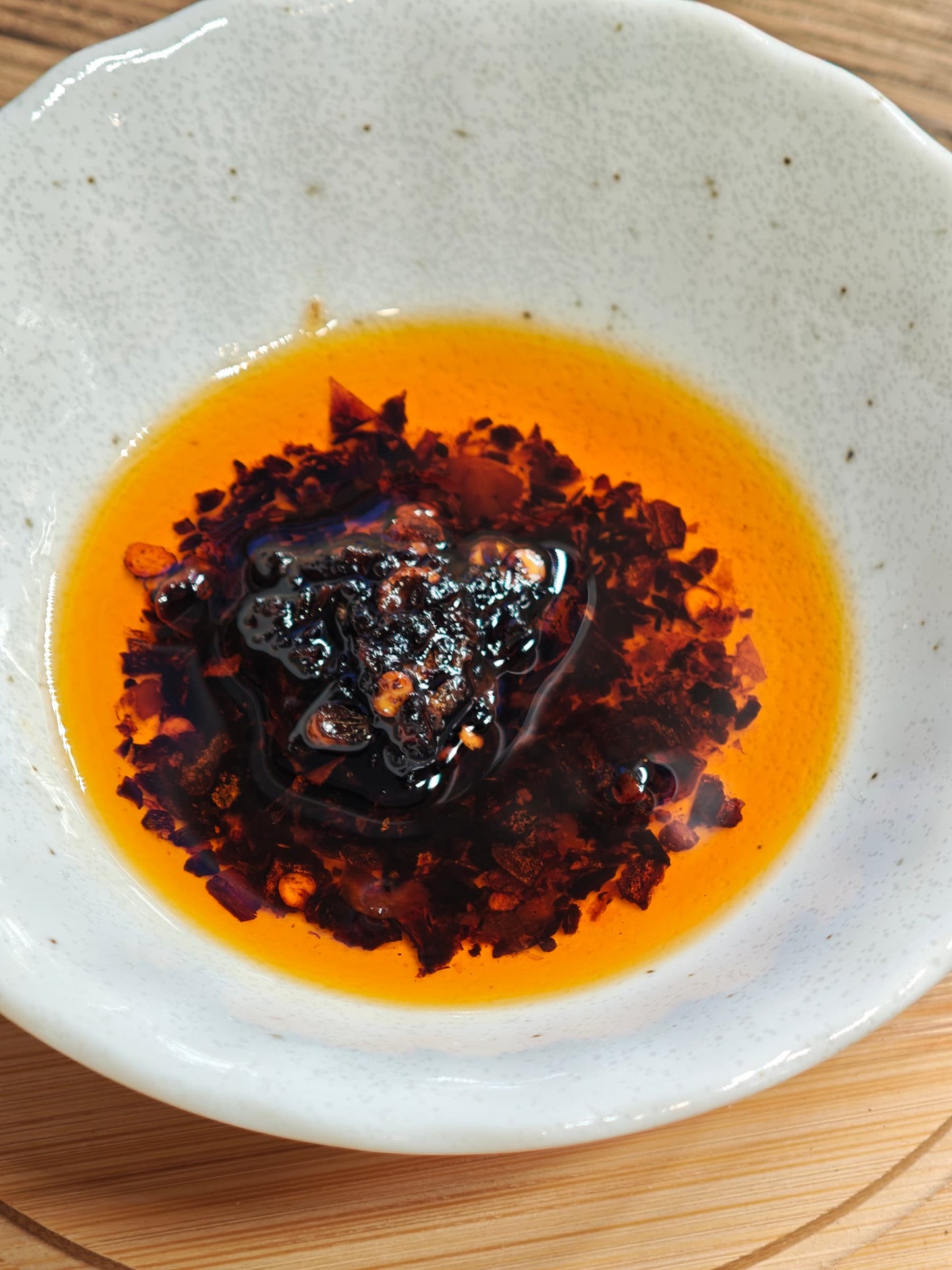 Jiang! x Sim Sim Foods - Crunchy Chilli Oil  in small dish close up